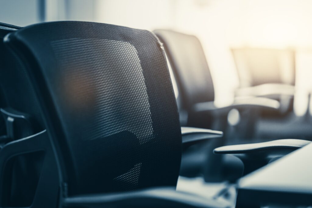 Close up black chair on meeting room in modern office.